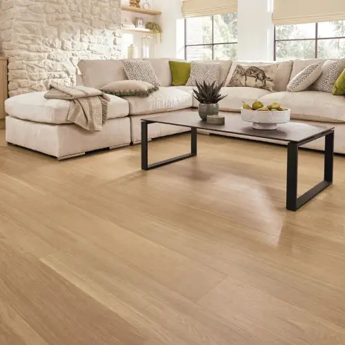Honey oak wood-grain vinyl flooring installed in a Dubai living room