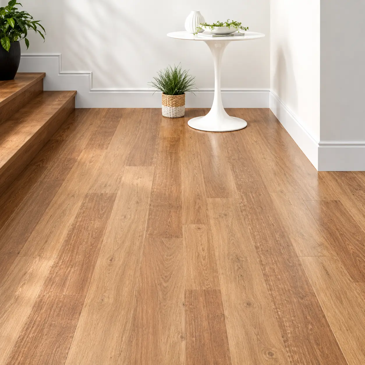 Wood-look vinyl flooring installed over existing tiles on a Dubai staircase landing