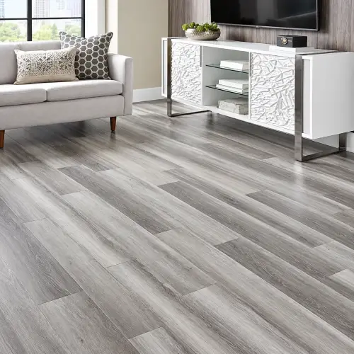 Silver grey oak wood-grain vinyl flooring installed in a Dubai living room