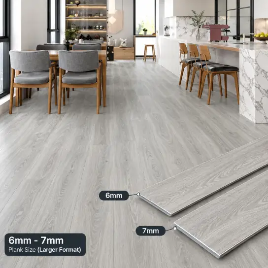 Grey oak heavy-duty vinyl plank flooring in 6mm and 7mm thickness in a Dubai open-plan kitchen and dining area